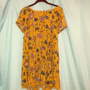 Mustard printed color dress has fringe design hem